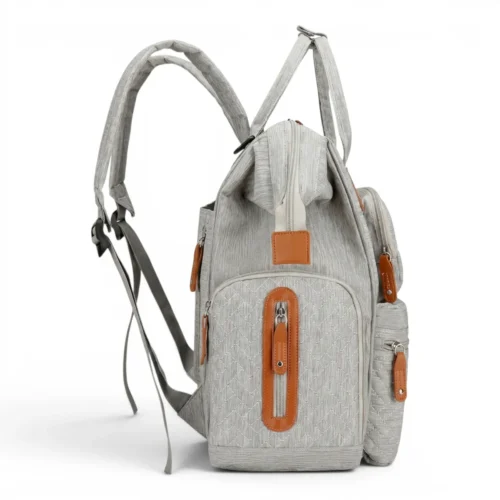 Sac à dos à langer matelassé gris Sac de maternité de profil en toile grise avec fermetures marron
