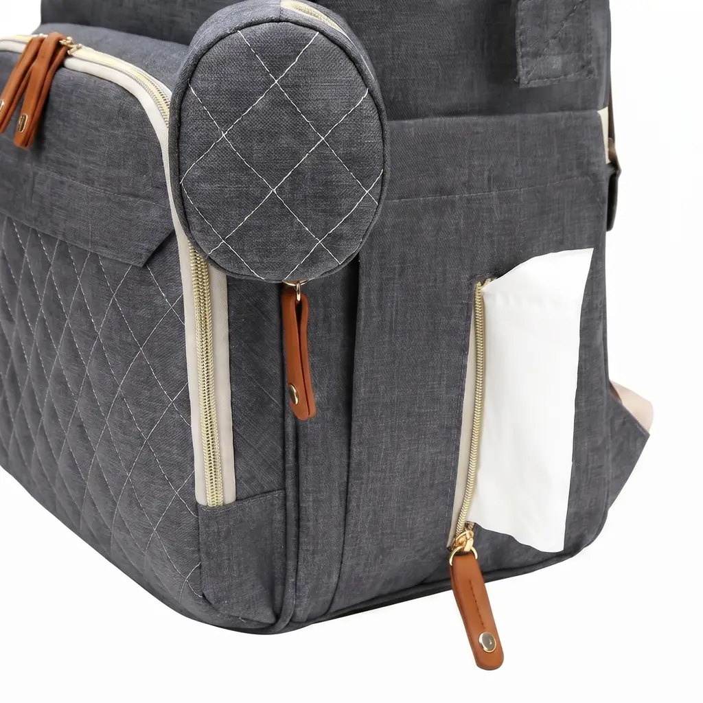 Quilted mother's backpack with tissue pocket and matching round pouch.
